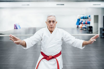 Senior karate master performing combat techniques