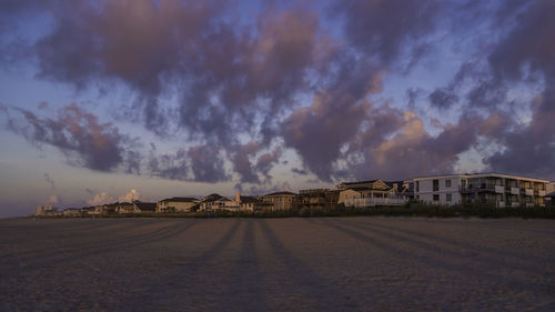 Panoramic shot of buildings against sky in city