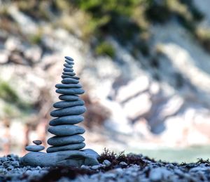 Close-up of pebbles stacked on land