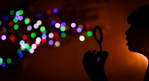Close-up of hand holding illuminated lights