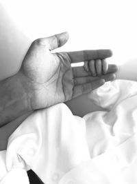 Cropped hand of doctor examining patient