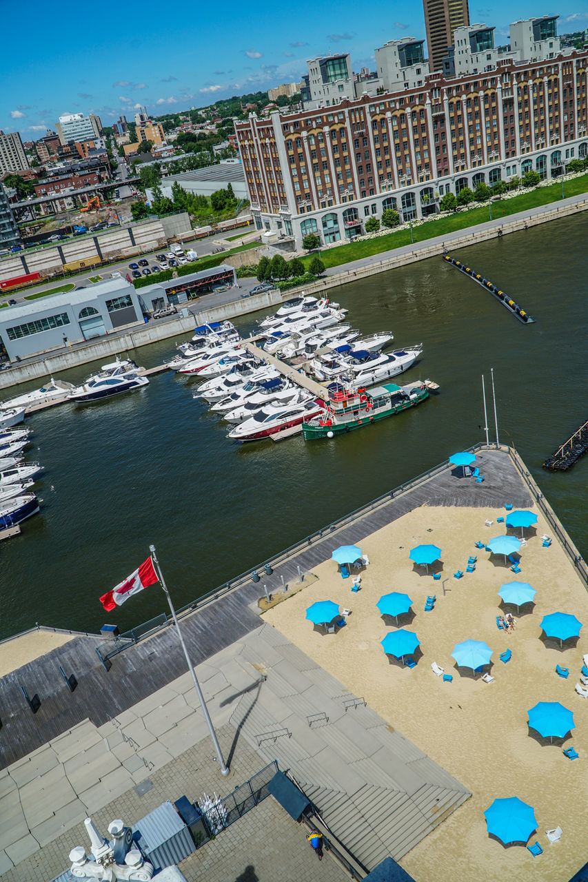 HIGH ANGLE VIEW OF BUILDINGS BY SEA