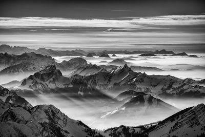 Panoramic view of snowcapped mountains against sky