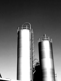 Low angle view of smoke stack against sky