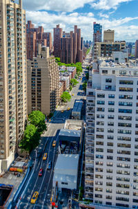 High angle view of street amidst buildings in city