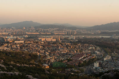 High angle view of townscape against sky during sunset