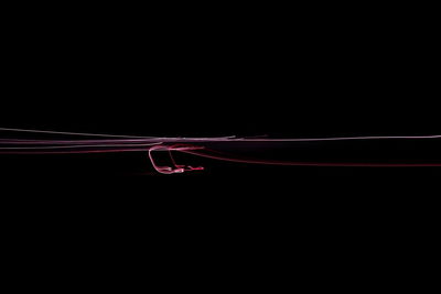 Light trails over black background