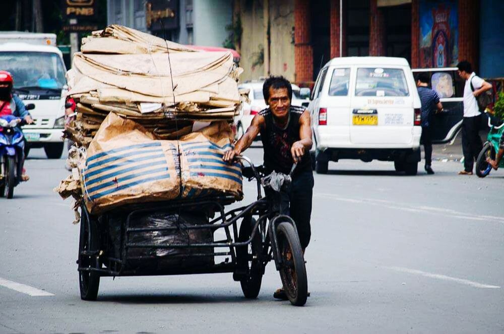 transportation, mode of transport, lifestyles, land vehicle, car, full length, leisure activity, casual clothing, young adult, street, men, travel, young men, front view, sitting, city life, warm clothing, person