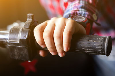 Close-up of man holding camera