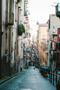 Street amidst buildings in city against sky