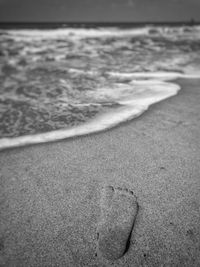 Close-up of sand at beach