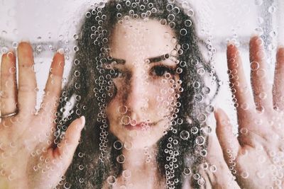 Close-up of wet girl in water