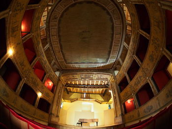 Low angle view of illuminated ceiling