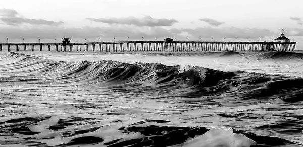 Pier over sea against sky