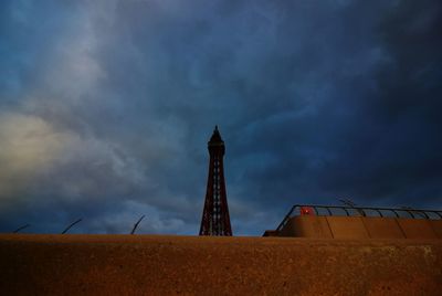 Low angle view of building against cloudy sky