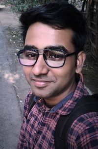 Portrait of young man wearing eyeglasses