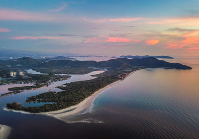 Aerial view of sea against sky during sunset