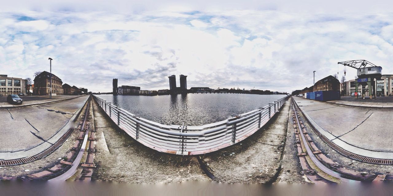 water, architecture, built structure, sky, building exterior, transportation, nautical vessel, panoramic, cloud - sky, moored, mode of transport, cloudy, cloud, river, boat, city, harbor, waterfront, in a row, outdoors