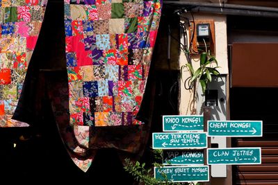 Information sign on column by multi colored fabrics