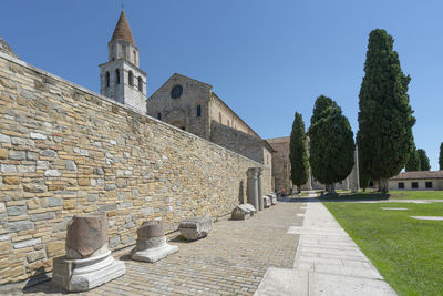 Some roman archaeological finds in front of the basilica of aquileia, italy