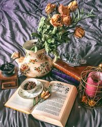 High angle view of flower bouquet on book