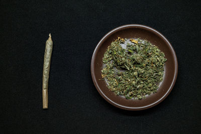 High angle view of food on table against black background