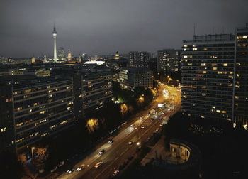 High angle view of illuminated buildings in city at night