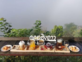High angle view of breakfast on table against trees