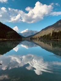 Scenic view of lake and mountains against sky