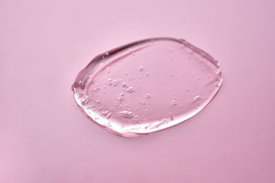 Close-up of water against pink background