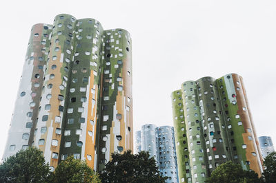 Low angle view of modern buildings against clear sky