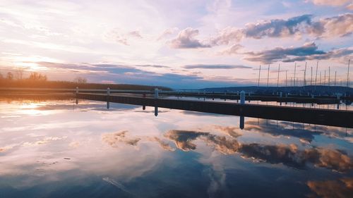 Scenic view of lake against sky during sunset