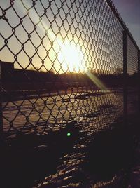 Chainlink fence at sunset