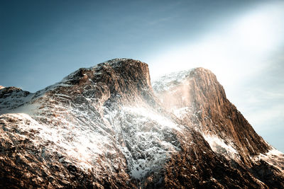 Low angle view of rock formation against sky