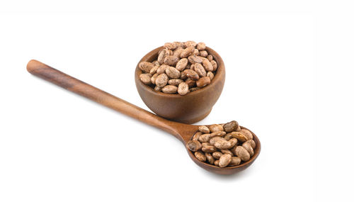 High angle view of bread in container against white background