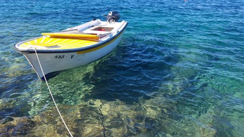 High angle view of yellow boat in sea