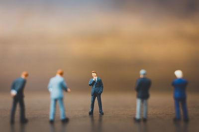 Figurines on wooden table