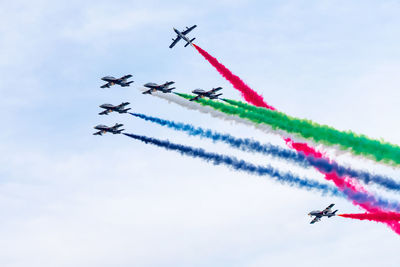 Al fursan aerobatic team doing stunts in the sky in abu dhabi, uae