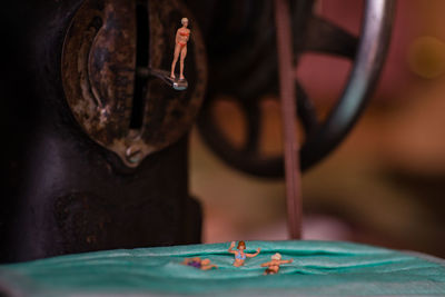 Close-up of person wearing eyeglasses on table