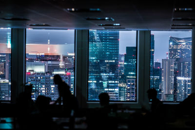 Illuminated buildings in city at night