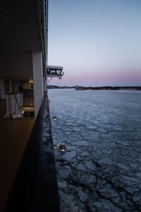 Scenic view of sea against clear sky at dusk