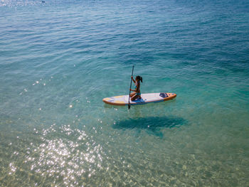 High angle view of man swimming in sea