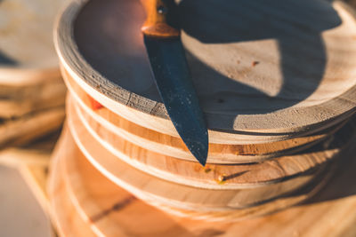 Close-up of knife on wooden container