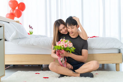 Young couple sitting on sofa