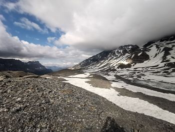 Scenic view of snowcapped mountains against sky