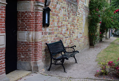 Empty bench in front of building