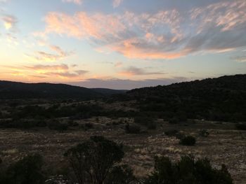 Scenic view of landscape against sky during sunset