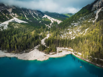 Scenic view of lake and mountains against sky