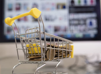 Close-up of yellow basket on display at store