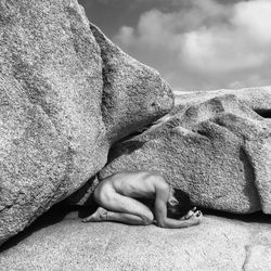 Close-up of man hand on rock